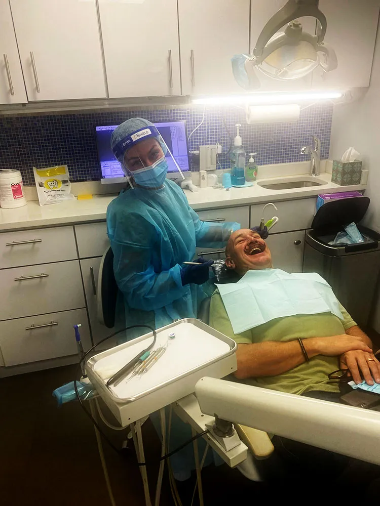 Dental staff working with a patient