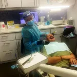 Dental staff working with a patient