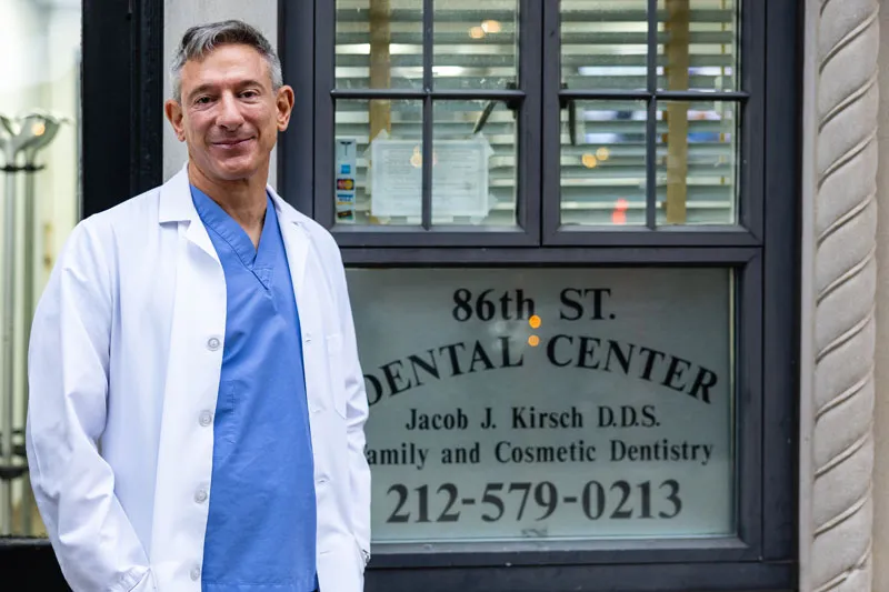 Dr. Kirsch standing in front of his office, 86th Street Dental Center